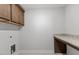 Convenient laundry area with countertop and cabinet storage at 347 N. Maple Walk Dr # 211, Garner, NC 27529