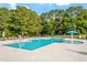 Community pool with seating and a splash pad at 347 N. Maple Walk Dr # 211, Garner, NC 27529