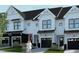 Beautiful new townhomes feature modern design with a white and black color scheme and attached garages at 4093 Elk Crk Ln, Raleigh, NC 27612