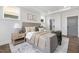 Comfortable bedroom with a padded headboard, nightstands, and neutral color scheme at 4093 Elk Crk Ln, Raleigh, NC 27612