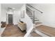 Inviting entryway with modern staircase and hardwood floors at 4093 Elk Crk Ln, Raleigh, NC 27612