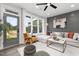 Modern living room with a large window, stylish seating, and contemporary decor at 4095 Elk Crk Ln, Raleigh, NC 27612