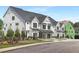 Street view of newly constructed townhomes showcasing their modern architectural design and landscaping at 4095 Elk Crk Ln, Raleigh, NC 27612