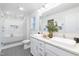 Modern bathroom with double sinks, a glass-enclosed shower, and stylish tile flooring at 41 Silver Moon Ln # 115, Clayton, NC 27527