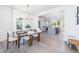 Bright dining room with a wood table, seating for six, and views into the modern kitchen at 41 Silver Moon Ln # 115, Clayton, NC 27527