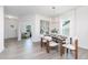 Elegant dining room featuring a modern chandelier, a wood table, and comfortable seating at 41 Silver Moon Ln # 115, Clayton, NC 27527
