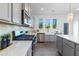 Well-lit kitchen with grey cabinets, stainless steel appliances, white countertops, and modern fixtures at 41 Silver Moon Ln # 115, Clayton, NC 27527