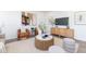 Cozy living room with contemporary decor, including a modern console, stylish art, and comfortable seating at 41 Silver Moon Ln # 115, Clayton, NC 27527