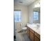 Well-lit bathroom featuring a single sink vanity and a window at 441 Hill Rd, Rougemont, NC 27572