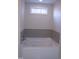 Relaxing bathroom features a luxurious soaking tub with tile surround at 441 Hill Rd, Rougemont, NC 27572