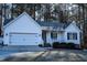 Charming single-story home featuring a two-car garage and inviting front porch at 441 Hill Rd, Rougemont, NC 27572