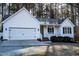 Charming single-story home featuring a two-car garage and inviting front porch at 441 Hill Rd, Rougemont, NC 27572