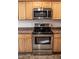 Well-equipped kitchen with stainless steel appliances and light wood cabinetry at 441 Hill Rd, Rougemont, NC 27572