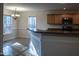 Bright kitchen features stainless appliances, breakfast bar, and adjacent dining area at 441 Hill Rd, Rougemont, NC 27572