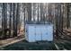 Exterior view of a white storage shed located in the backyard at 441 Hill Rd, Rougemont, NC 27572