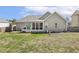 A partial view of the back of the house with a deck, porch, and large yard at 457 Cokesbury Park Ln, Fuquay Varina, NC 27526