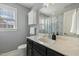 This full bathroom features a dark vanity with a white marble countertop and shower with curtain at 457 Cokesbury Park Ln, Fuquay Varina, NC 27526