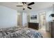 This bedroom showcases the bed, a dark dresser and access to the Primary bathroom at 457 Cokesbury Park Ln, Fuquay Varina, NC 27526