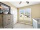 Cozy bedroom featuring a dresser, a window, and neutral paint at 457 Cokesbury Park Ln, Fuquay Varina, NC 27526