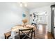 Cozy dining room features a round table, a table runner, and easy access to the living room and kitchen at 457 Cokesbury Park Ln, Fuquay Varina, NC 27526