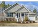 Charming single-story home with a classic facade, well-maintained landscaping, and a two car garage at 457 Cokesbury Park Ln, Fuquay Varina, NC 27526