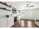 Comfortable living room with a fireplace, built-in cabinets and floating shelves at 457 Cokesbury Park Ln, Fuquay Varina, NC 27526