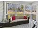 Screened-in porch with a cushioned outdoor sofa and a view of the backyard at 457 Cokesbury Park Ln, Fuquay Varina, NC 27526