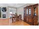 The dining area features hardwood floors, a hutch, and an open view into the kitchen at 4606 Kings Garden Rd, Raleigh, NC 27612