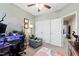 A view of the upstairs office space with desk, chair, storage, carpet and ceiling fan at 4606 Kings Garden Rd, Raleigh, NC 27612