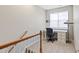 A view of the upstairs office space with desk, chair, carpet and natural light at 4606 Kings Garden Rd, Raleigh, NC 27612