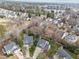 An aerial view of a residential neighborhood with tree-lined streets and manicured lawns at 4745 Grand Cypress Ct, Raleigh, NC 27604