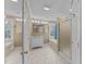 This bathroom features a vanity, tiled floors, separate shower, and soaking tub beneath a window at 4745 Grand Cypress Ct, Raleigh, NC 27604