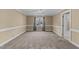 Bedroom with carpeted floor and a large window at 4745 Grand Cypress Ct, Raleigh, NC 27604