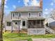 This home has a rear exterior with a screened porch and a fenced yard at 4745 Grand Cypress Ct, Raleigh, NC 27604