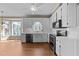 Bright kitchen featuring white cabinets, modern appliances, and hardwood floors at 4745 Grand Cypress Ct, Raleigh, NC 27604