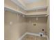 Storage closet with hardwood floors and white shelving at 4745 Grand Cypress Ct, Raleigh, NC 27604