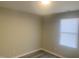 This is a plain bedroom with hardwood floors, neutral walls, and windows, offering a blank canvas for personalization at 523 E Nelson Ave, Wake Forest, NC 27587