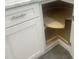 Kitchen cabinet showing a unique pie-cut lazy susan storage and stainless steel hardware at 523 E Nelson Ave, Wake Forest, NC 27587