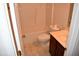 Bathroom featuring a shower-tub combo, toilet, and single sink vanity at 5402 Whisperwood Dr, Durham, NC 27713