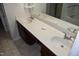 Bathroom vanity featuring dual sinks, laminate counters, and wood cabinets at 5402 Whisperwood Dr, Durham, NC 27713
