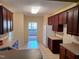 Bright kitchen with light countertops and sleek, dark cabinets at 5402 Whisperwood Dr, Durham, NC 27713