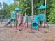 Community playground with climbing structure, slide, and stairs at 5402 Whisperwood Dr, Durham, NC 27713