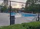 Community swimming pool with lounge chairs and well maintained lawn at 5402 Whisperwood Dr, Durham, NC 27713