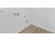 Unfinished basement with a drop ceiling, utility connections and hardwood floors at 55 Mable Court # 5, Lillington, NC 27546