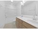 Bathroom featuring double sinks, wooden vanity, a bathtub and tile flooring at 55 Mable Court # 5, Lillington, NC 27546