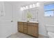 Bathroom featuring double sinks, wooden vanity, and ample lighting at 55 Mable Court # 5, Lillington, NC 27546