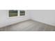 Minimalist bedroom with a large window overlooking a rural landscape at 55 Mable Court # 5, Lillington, NC 27546