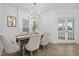 Dining room with modern chandelier and view into backyard at 55 Mable Court # 5, Lillington, NC 27546