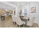 Dining area with modern chandelier and access to the kitchen at 55 Mable Court # 5, Lillington, NC 27546