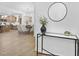 Inviting entryway showcasing a console table with a decorative vase, leading to the kitchen and dining area at 55 Mable Court # 5, Lillington, NC 27546